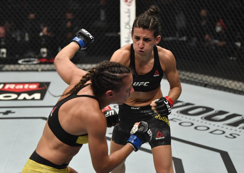 Marina Rodriguez of Brazil punches Amanda Ribas of Brazil in a strawweight fight during the UFC 257 event